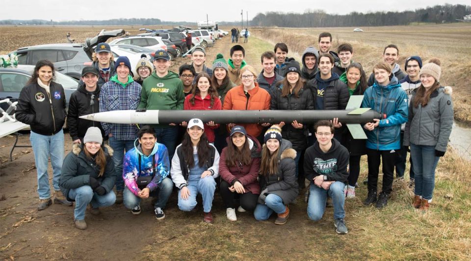 ND Rocketry group photo with their rocket